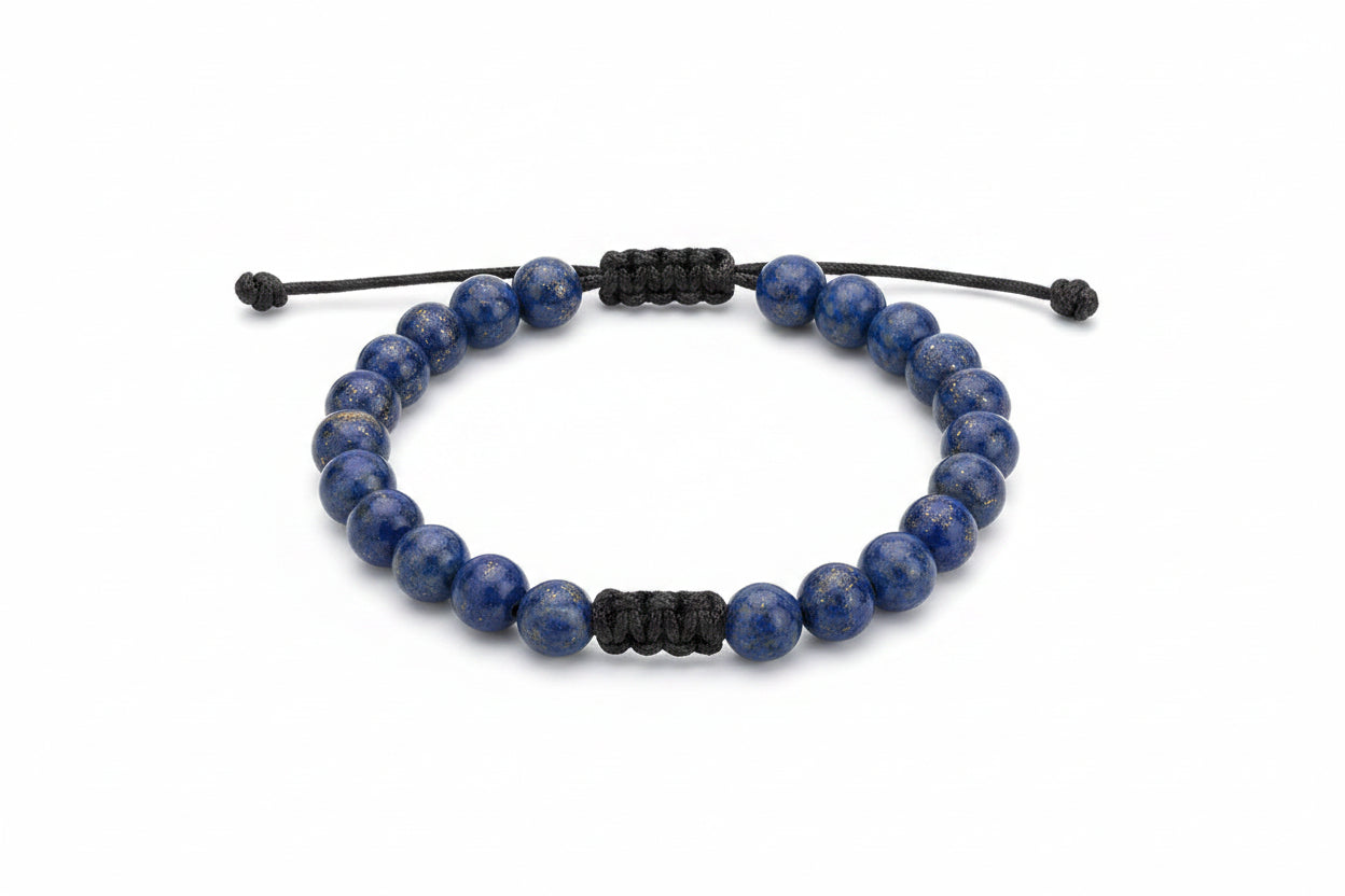Blue beaded bracelet with black cord and brand tag on a white background